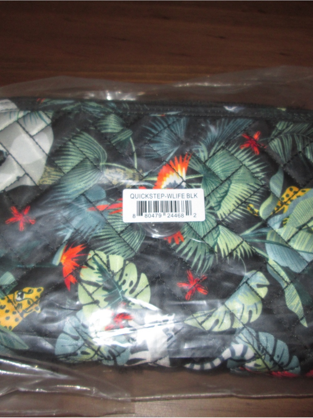 lug Quilted Black Cosmetic Pouch with Green Tropical Leaf and Red Accents